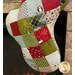 A close up shot of the bottom of the stocking, demonstrating the fusible patchwork design.