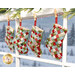 A closer look at the four stockings, hung on a striped string by clothespins in a window that looks over a snowy scene.
