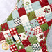 A super close up on one of the stockings, demonstrating fabric colors and fusible grid details.