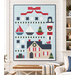 A mockup of the quilt, staged on a white shiplap wall in a Nantucket style home.