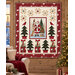 A mockup of the quilt, staged on an oak wood wall with coordinating décor.