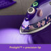 A vibrant purple iron rests on purple fabric.
