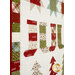 A close up on the patchwork of the quilt, showing details on a row of stockings.