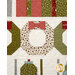 A close up on the patchwork of the quilt, showing details on a row of wreaths.