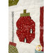 A super close up on one of the patchwork ornaments, demonstrating fabric color and print details.