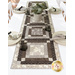 An angled shot of the runner staged with coordinating table settings, demonstrating fabric prints and patchwork details.