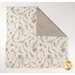 A top down shot of the napkin, folded so as to demonstrate the two reversible prints.