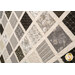 An angled close up on the patchwork, demonstrating fabric prints, colors, and top quilting effects.