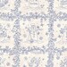 Closer shot of the mottled cream fabric with blocks of navy blue stylized vines and wintry motifs like snowflakes, snowmen, stars, and more.