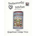Front of the Gingerbread Cottage Drum cross stitch pattern showing the finished drum pin project