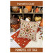 The front of the pattern showing the finished project pillow staged amongst coordinating Autumn decor.