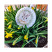 Bunny cross stitch pattern laid in a bed of florals.