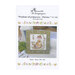 Front cover of the cross stitch pattern with the finished pattern stitched onto a neutral finishing board on a white blanket.