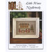 Cross-stitch chart cover for Little House Needleworks, “Hometown Holiday – Quilt Shop.”