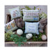 Photo of the finished pillows laid in a basket of spring motifs.