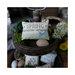 Photo of a wooden tower holding the spring pillow next to a small egg.