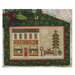 Cross-stitched bookstore scene with a building, tree, bench, and snowflakes.