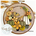 A image of the finished project attached to a hoop and staged with fall decor