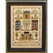 The little house neighborhood cross stitch pattern finished in a wooden frame.
