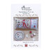 Front cover of the cross stitch pattern with the finished patterns stitched onto a pillow on top of a wooden table.