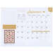 example of the September monthly spread featuring the full monthly view, a notes section, a quilt pattern image