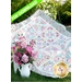 A colorful quilt drapes over grass, next to a white vase filled with pink flowers, with a PDF DOWNLOAD banner on the top left corner.