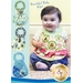 A baby girl wearing a colorful bib smiles at the camera. Three designs of baby bibs are displayed on the left side, featuring floral patterns. The text at the top reads Beautiful Baby Bibs! with a logo for Shabby Fabrics at the bottom.