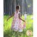 A little girl wearing the Tea Party Dress showing the back of the dress.