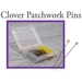 A clear plastic case containing Clover patchwork pins, with some yellow and blue pins visible inside. The background features the text Clover Patchwork Pins.