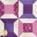 The fifth purple and white block in the Learn to Quilt Beginner Quilt