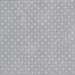 mottled light gray fabric with tiny cream polka dots