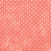 Fabric featuring tiny cream polka dots on mottled pink