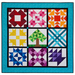 A colorful quilt featuring nine distinct blocks in various patterns and colors, arranged in a three-by-three grid. The blocks include shapes such as stars, a tree, and geometric designs, all framed by a turquoise border.