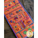 A piece of orange fabric featuring various colorful embroidery stitches and decorative elements arranged in rows. The design includes flowers, geometric shapes, and intricate patterns. The edges are trimmed with a purple border.