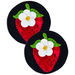 Two circular wool mats featuring a red strawberry with green leaves and a white flower on a black background.