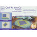 Image showing a quilting kit package titled Quilt As You Go Placemat. The package includes instructions for making placemats using pre-printed batting. It features three steps: cutting fabric, sewing by number, and completing a placemat in 20 seams. The finished size of each placemat is approximately 19 inches by 15 inches.