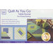 Image of a quilting kit packaging for a Quilt As You Go table runner. It features instructions with three steps: cut fabric, sew by number, and complete a table runner in 30 seams. The design includes a blue and green pattern with a finished size of 48 inches by 15 inches.