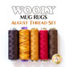 Five spools of thread in various colors, labeled as part of the Wooly Mug Rugs August Thread Set. The colors include dark brown, gold with a zigzag pattern, solid yellow, red, and a lighter brown, all isolated on a white background.