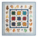 A colorful quilt featuring a patchwork design and various appliquéd animals around the border.