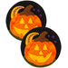 Two circular Halloween-themed wool mats featuring carved pumpkins with smiling faces. The pumpkins are orange with yellow features and have brown tops, set against a black background with purple stars and a crescent moon.