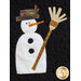 A decorative appliqué design featuring a snowman with a carrot nose, black eyes, and a top hat adorned with greenery. The snowman holds a broom and is set against a black background.