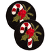 Two round coasters featuring embroidered designs of candy canes and holly on a black background.