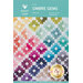 The front of the Ombre Gems Quilt pattern showing a geometric array of diamond-like blocks in a rainbow of colors.