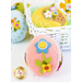 A pink felt Easter egg adorned with a blue flower and small colorful embellishments, placed in a white basket with other decorative eggs.