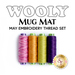 Image showing a collection of sewing thread spools in various colors arranged in a row of 4. The text above reads WOOLY MUG MAT and MAY EMBROIDERY THREAD SET. A logo from Shabby Fabrics is visible at the bottom right corner.