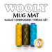 Three spools of embroidery thread in yellow, olive green, and blue are displayed above the text WOOLY MUG MAT and AUGUST EMBROIDERY THREAD SET. The logo for Shabby Fabrics is shown at the bottom.