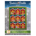 A quilt design featuring a grid of nine colorful barn-themed blocks, each with decorative elements like animals and holiday motifs. The top of the image displays the title Santa's Stable Quilt, and the bottom includes the website name ShabbyFabrics.com with a logo. The background has a snowy theme.