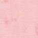 A pastel pink colored grunge textured fabric