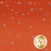 An orange fabric background with various blue stars and dots scattered across it, featuring a logo that reads Shabby Fabrics in the corner.