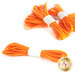 Five bundles of orange elastic cords are arranged on a white background, with four bundles positioned in the background and one in the foreground, all secured with white bands.